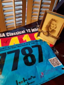 Two race bibs with photo of Mom